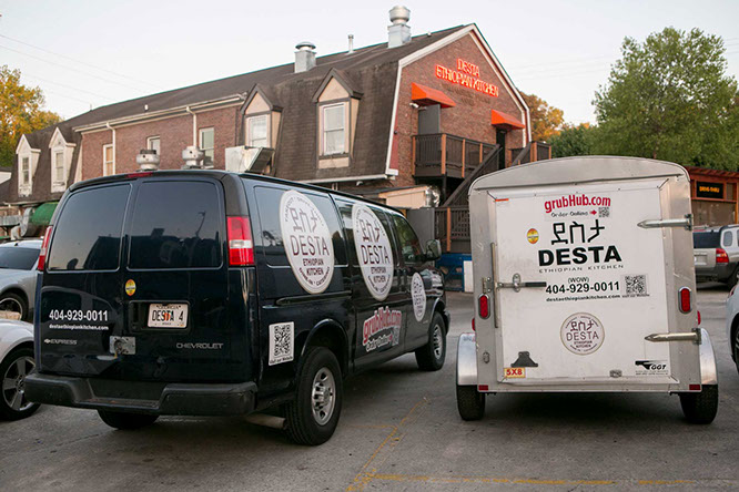 black and white catering vans